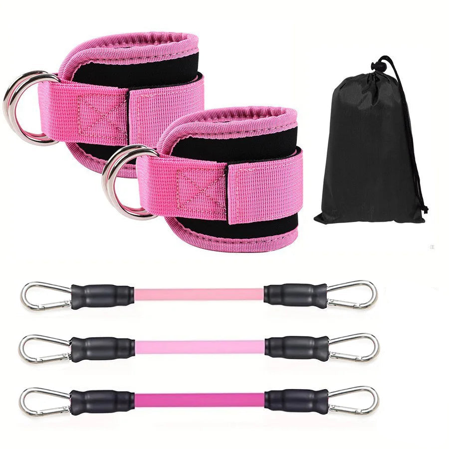 Pink resistance bands with carabiners and a black drawstring bag on a white background